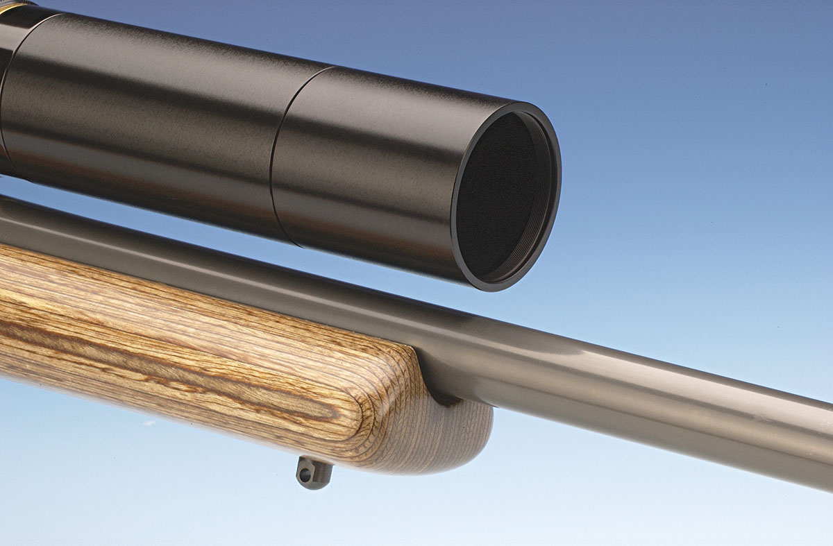 The stock is widened on the forearm to help in resting the gun in the field. The Leupold scope has an extension sunshade, and the barrel is heavy and tapered.