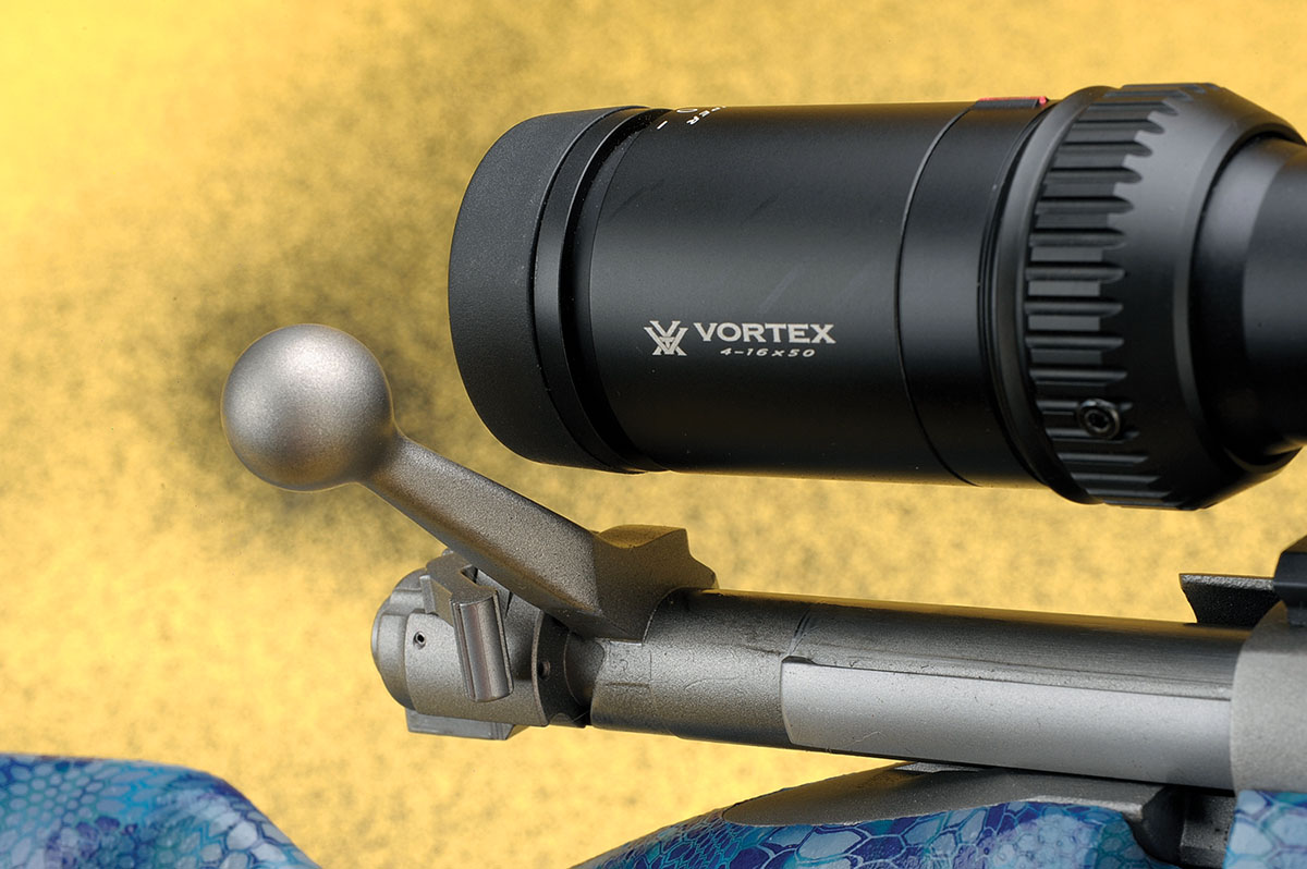 Even with the larger eyepieces on modern scopes, the bolt handle clears them easily.