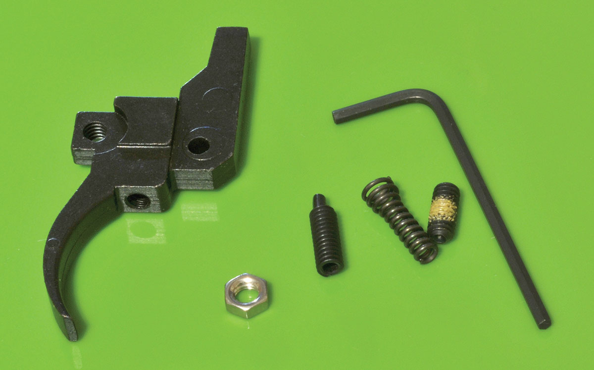 The RU-R trigger is comprised of the trigger, a safety screw and jam nut, a weight of pull adjustment screw and weight of pull spring. The rifle’s original trigger pivot pin (not shown) will be reused during installation.