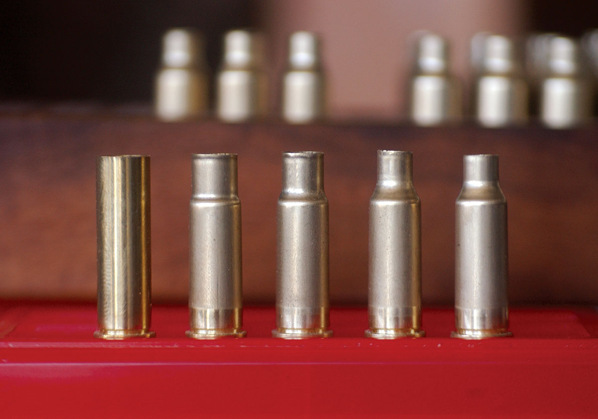 Forming 22 Super Jet brass starts with 357 Magnum brass (left). The three form dies from RCBS take the case down to .318 inch, .292 inch and finally .245 inch. The case at right has been full-length sized and trimmed.