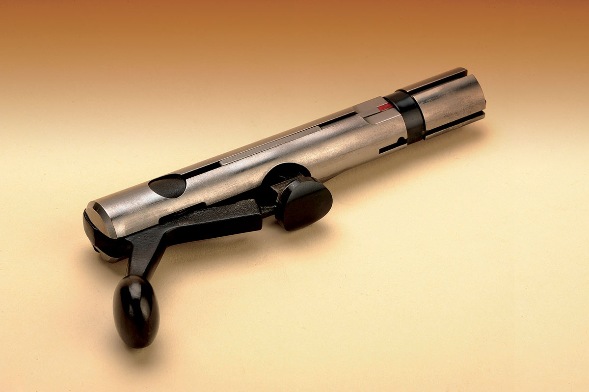 Here the locking lug is in the released position. When positioned in the rifle, this lug is drawn inward and locks into a recess in the receiver.