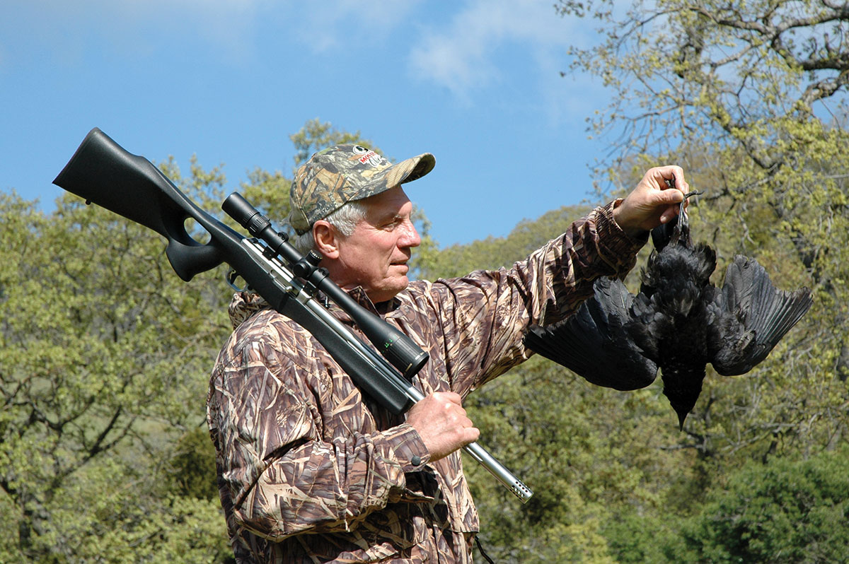 When gunning for smaller varmints such as this crow, Layne prefers the .17 HMR due to its flatter trajectory.