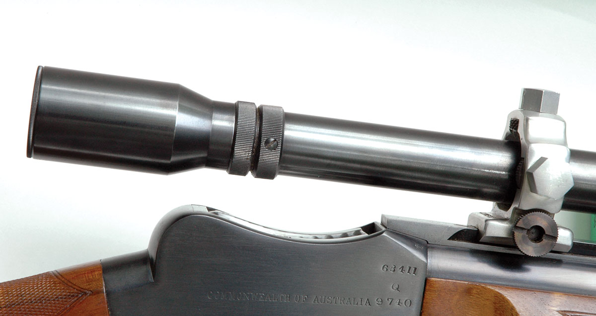 The small diameter of the Unertl 12x Varmint scope tube along with positioning its eyepiece toward the rear leaves adequate access to the top of the receiver for loading a cartridge and removing a fired case.