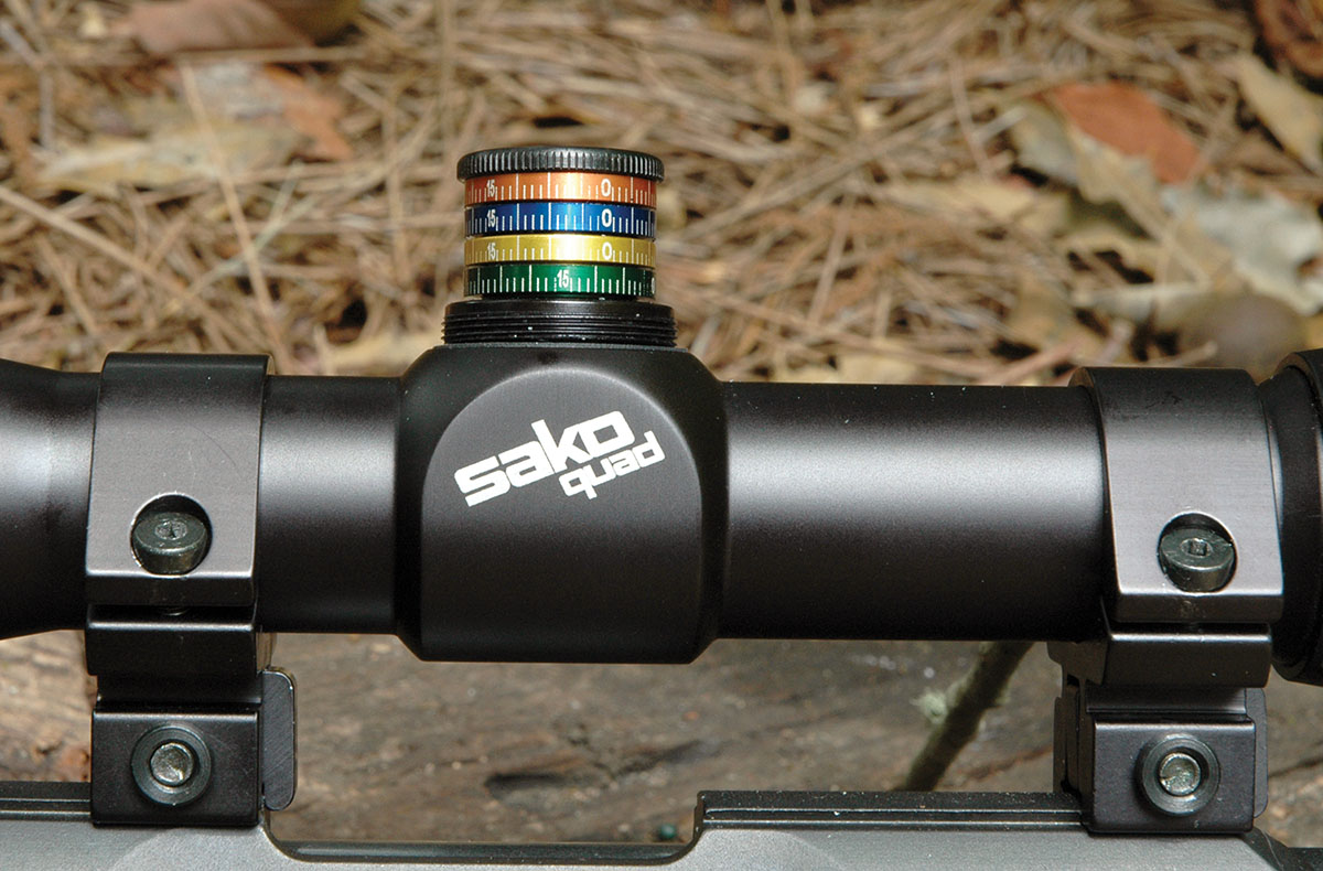 Four narrow aluminum bands on the windage and elevation turrets are loose enough to allow them to be rotated while the turrets are held stationary. The bands are used when individually zeroing the four barrels, and their colors match the color coding of the barrels.