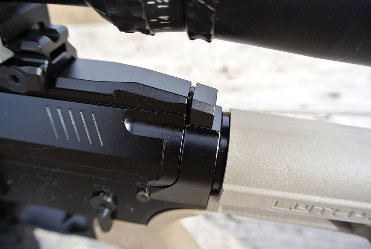 In most AR-style firearms, the gas key raceway is covered by the charging handle and helps to protect the shooter from liberated gas. Because the MT-15 uses a side-mounted charging handle, a threaded block had been added to the action to seal the raceway. The heavy gasket between the block and receiver effectively blocks blowback.
