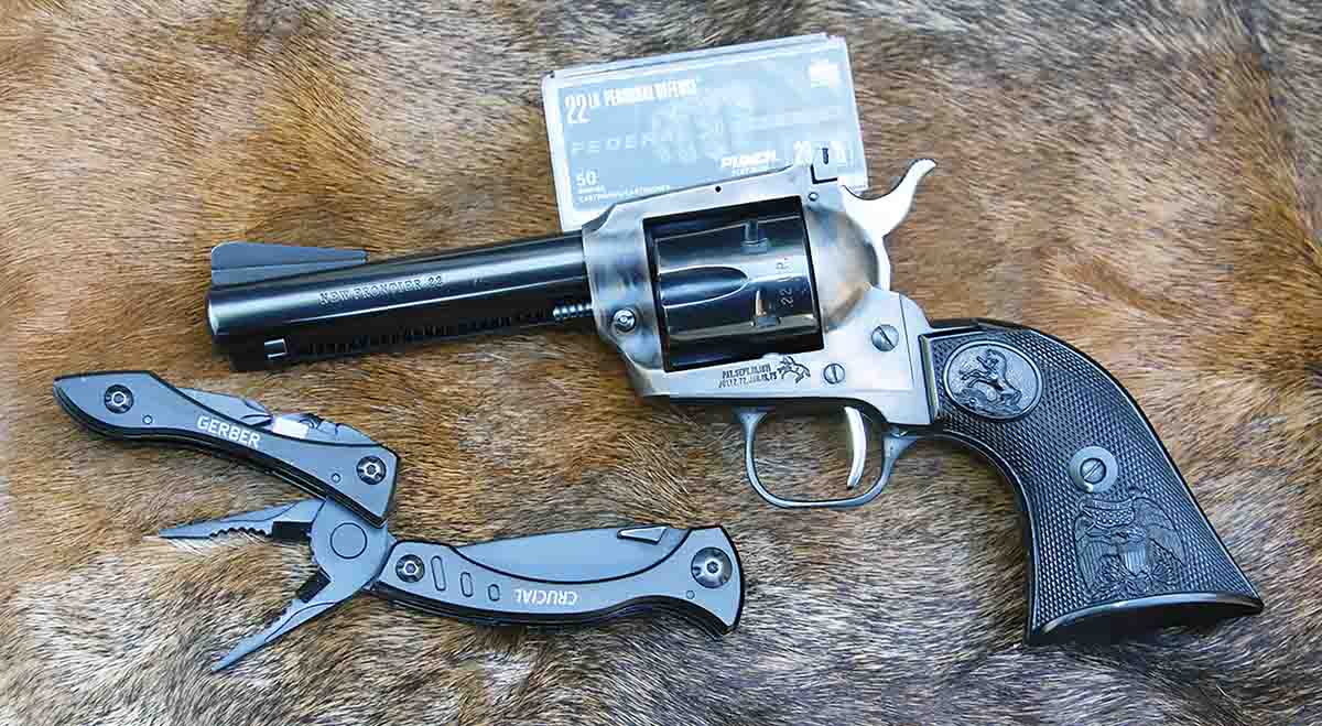 When heading out for a stroll with the downsized Colt .22LR, a small tool-like Gerber Crucial can come in handy for numerous things, including skinning the rabbit that was harvested for dinner.