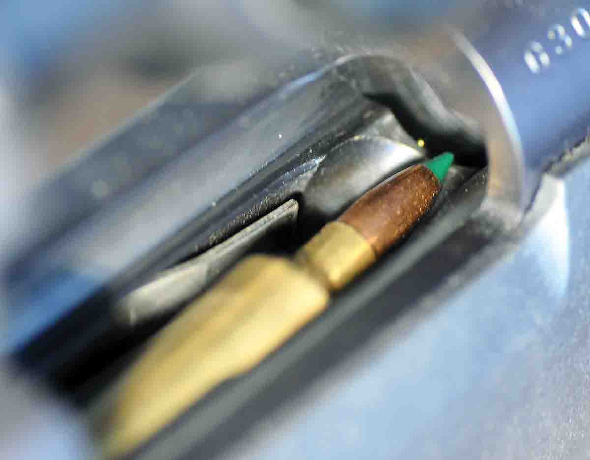 While the magazine is too short to accommodate loaded rounds, a single cartridge is easily fed into the short loading port and snapped into the top of the magazine with the bullet protruding up into the port.