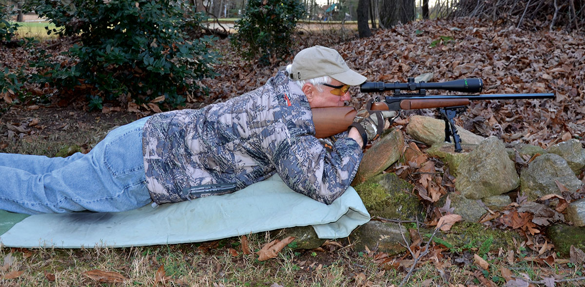 Layne in the field with a T/C Contender single-shot rifle chambered for the 5mm Rimfire Magnum.