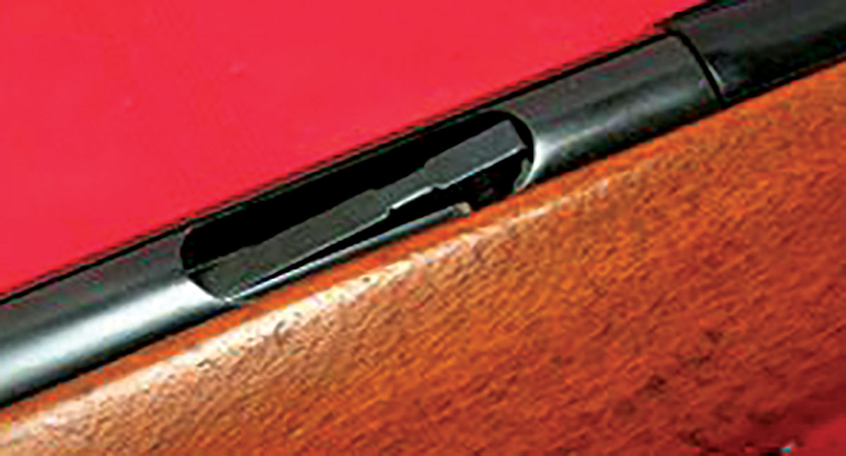 This close-up shows the bolt of the Model 591 closed and locked with its secondary extractor resting on a ramp machined into the receiver. The primary extractor resting below it cannot be seen.