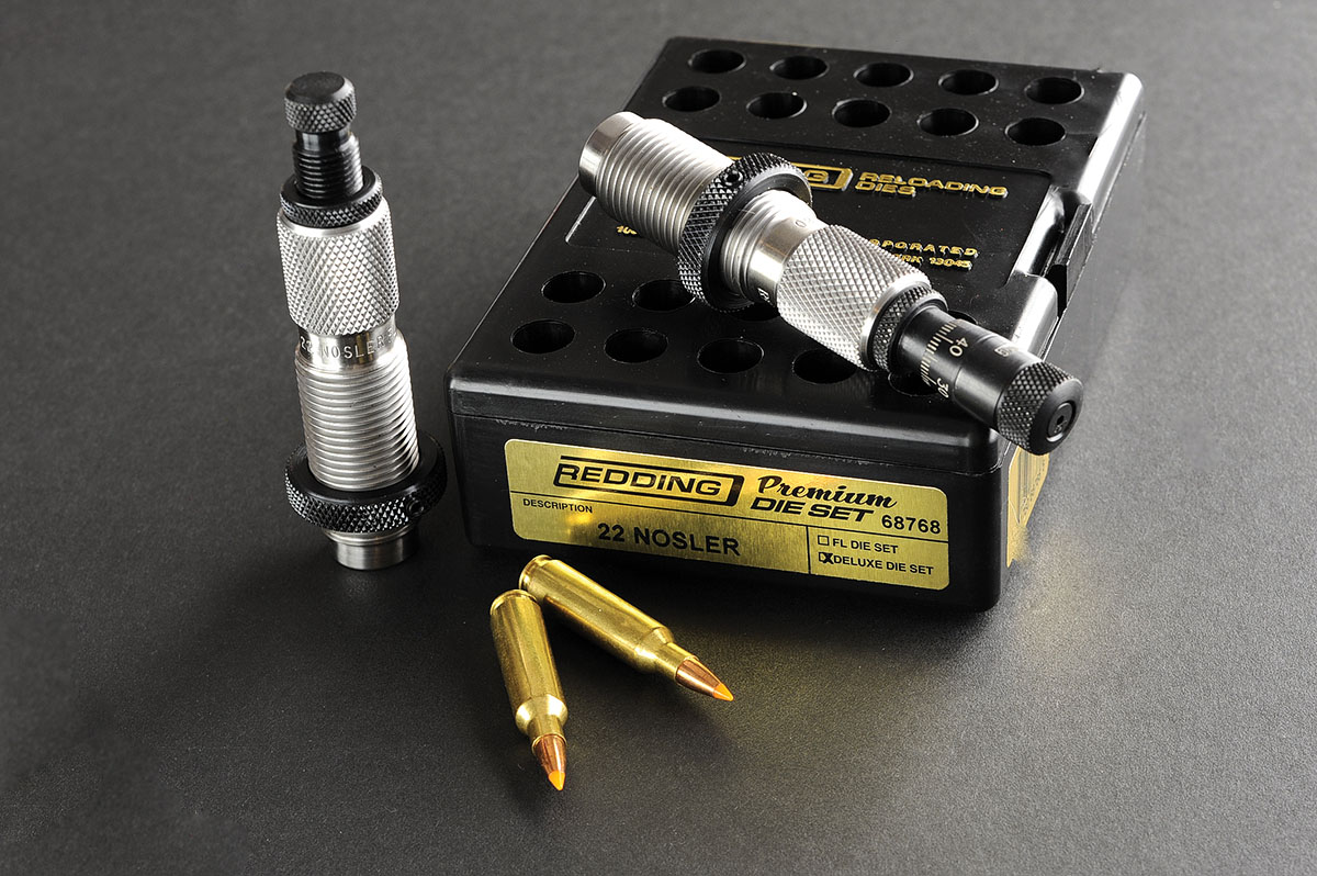 The Redding Premium die set with its box and a few samples of loaded rounds.