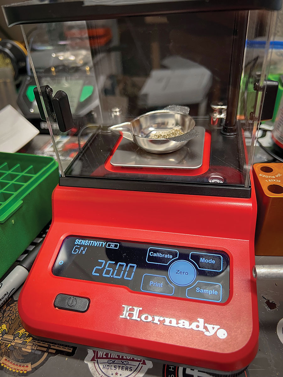 Weighing out each powder charge with a Hornady Precision Lab Scale and using Shooters World Precision Rifle powder.